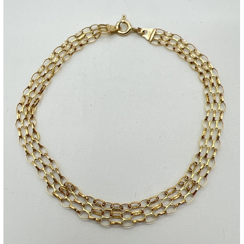 34 - A 7.5 inch 9ct gold triple row belcher chain bracelet with spring ring clasp. Gold marks on fixings ... 