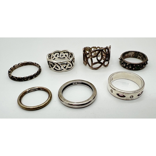 53 - 7 assorted silver and white metal band rings. To include a thin marcasite set ring, band set with am... 