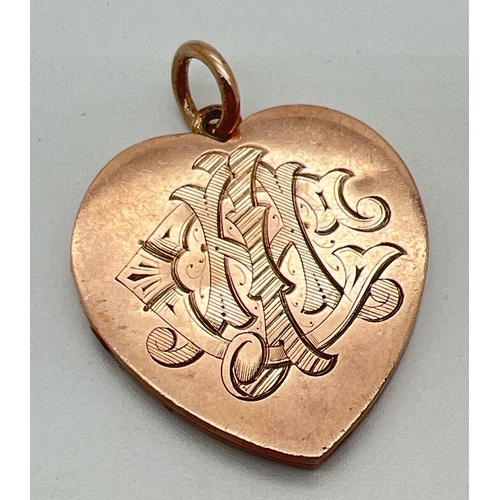 64 - An antique 9ct rose gold large heart shaped locket with engraved initials C I H to front. Gold mark ... 