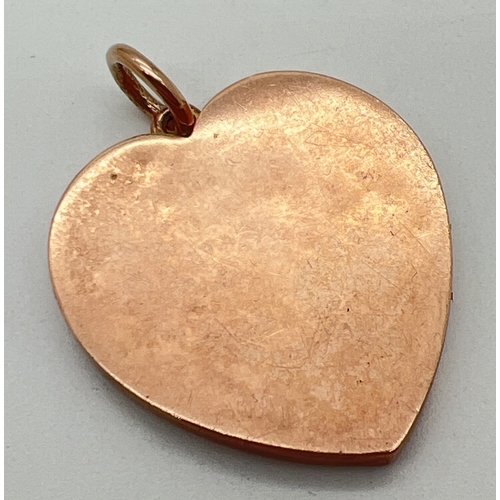 64 - An antique 9ct rose gold large heart shaped locket with engraved initials C I H to front. Gold mark ... 