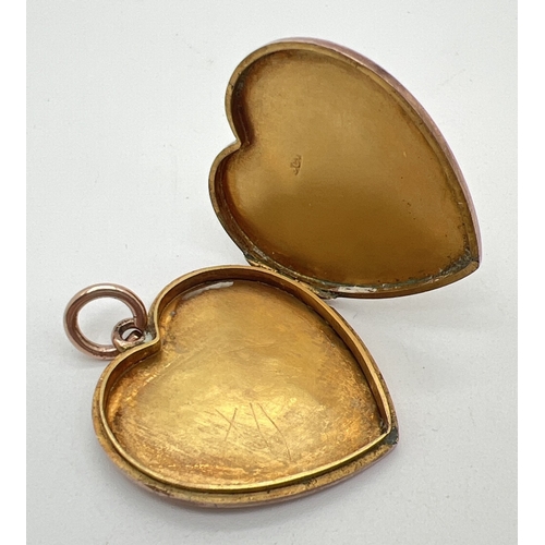 64 - An antique 9ct rose gold large heart shaped locket with engraved initials C I H to front. Gold mark ... 