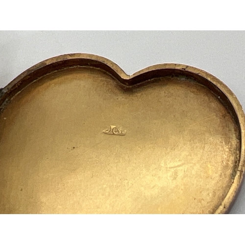 64 - An antique 9ct rose gold large heart shaped locket with engraved initials C I H to front. Gold mark ... 