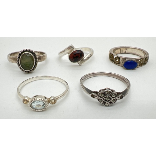 73 - 5 silver and white metal stone set dress rings. To include mahogany obsidian, amethyst, moss agate a... 