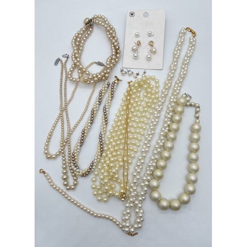 76 - A collection of vintage and modern faux pearl jewellery. To include a 30 inch double twist strand ne... 