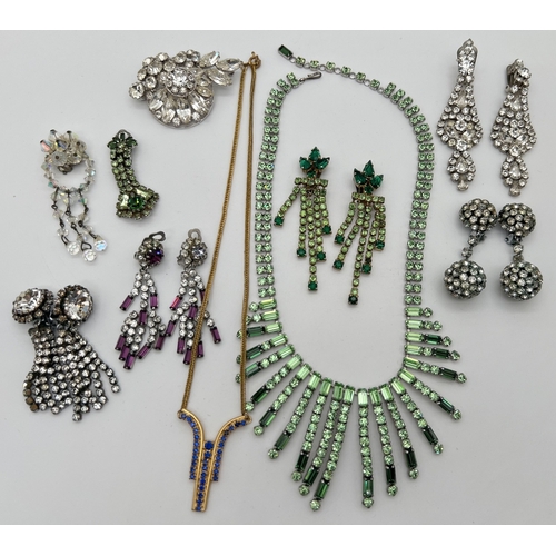 83 - A collection of vintage statement diamante jewellery in both clear and coloured designs to include p... 