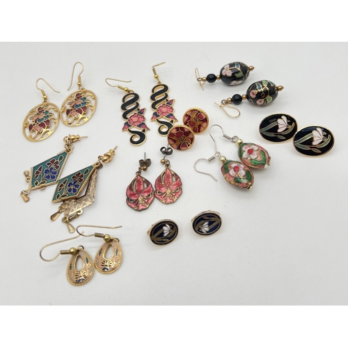 96 - 10 pairs of vintage enamel earrings in stud and drop styles. All of floral decoration in varying siz... 