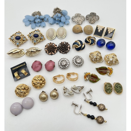 97 - 22 pairs of vintage clip on earrings in various colours and styles. To include glass cabochon and st... 