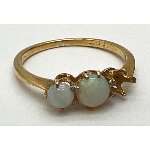 108 - An 18ct gold trilogy style dress ring set with opals - one stone missing. Gold mark inside band. Rin... 