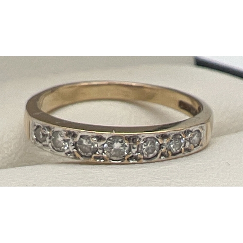 110 - A 9ct gold 0.25ct diamond set half eternity ring set with 7 graduating size round cut diamonds. Hall... 