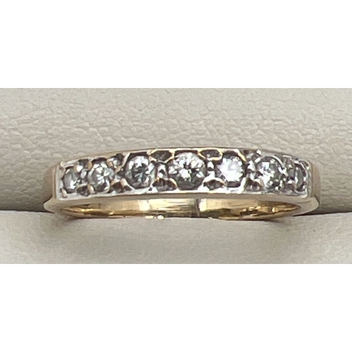 110 - A 9ct gold 0.25ct diamond set half eternity ring set with 7 graduating size round cut diamonds. Hall... 