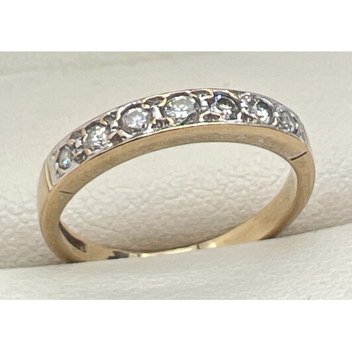 110 - A 9ct gold 0.25ct diamond set half eternity ring set with 7 graduating size round cut diamonds. Hall... 