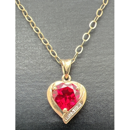 111 - A 9ct gold, ruby and diamond heart shaped pendant necklace. Pendant set with a heart shaped created ... 