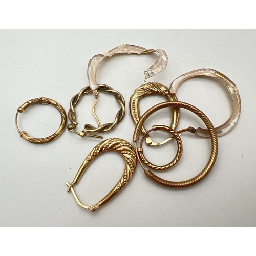 113 - A small quantity of scrap gold hoop style earrings. All marked or test as 9ct gold. Total weight app... 