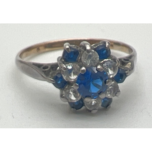 114 - A vintage 9ct gold and silver cluster style dress ring set with blue and white Spinel stones. Centra... 