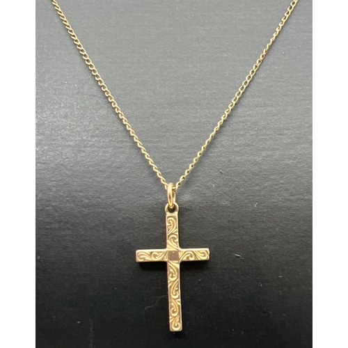 116 - A vintage 9ct gold cross shaped pendant with engraved decoration to front, on an 18