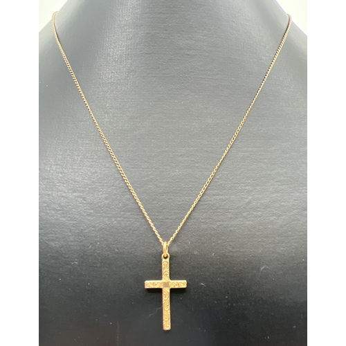 116 - A vintage 9ct gold cross shaped pendant with engraved decoration to front, on an 18