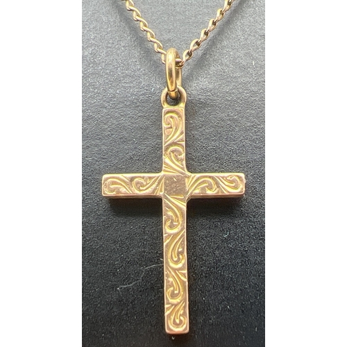 116 - A vintage 9ct gold cross shaped pendant with engraved decoration to front, on an 18