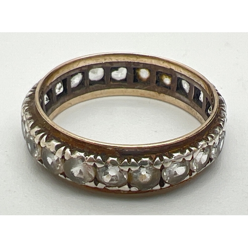 118 - A vintage 9ct gold and silver full eternity ring set with round cut clear stones. Wear to all stones... 