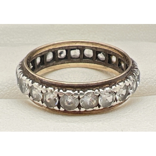 118 - A vintage 9ct gold and silver full eternity ring set with round cut clear stones. Wear to all stones... 