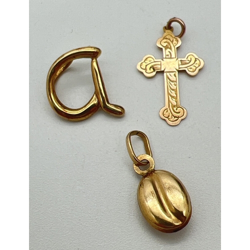 119 - 3 small 9ct gold pendants. A floating initial 