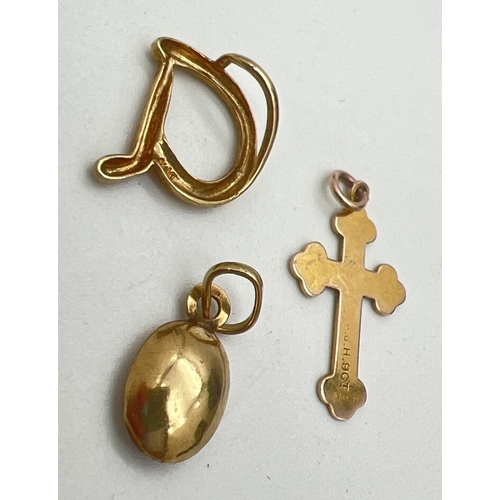 119 - 3 small 9ct gold pendants. A floating initial 