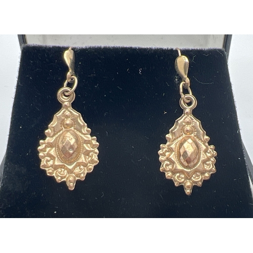 A pair of Victorian style gold drop earrings with small central panel with checkerboard design. Not marked but test as 9ct gold. Approx. 3cm long, total weight approx. 0.6g.