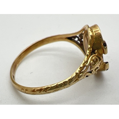 122 - A 14ct gold locket ring mount with floral decoration to shoulders, for scrap or repair. Top of locke... 