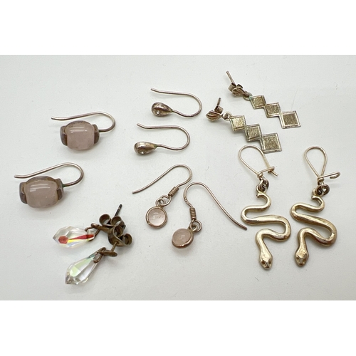 134 - 6 pairs of silver and white metal drop style earrings. To include serpents, quartz set and crystal t... 