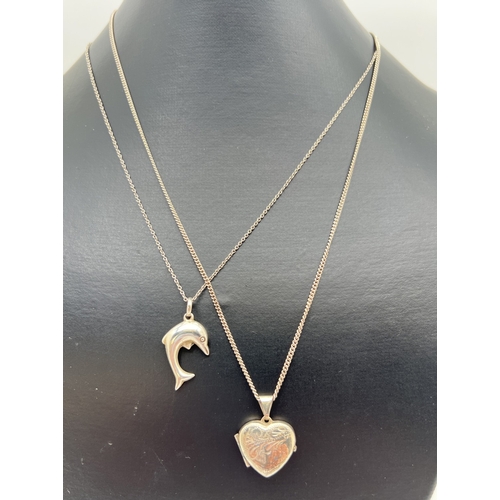 142 - 2 silver pendant necklaces. A dolphin on an 18