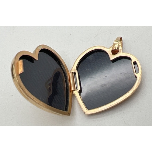 145 - A 9ct gold heart shaped locket with embossed scroll  & foliate design to front. Gold marks on fixed ... 