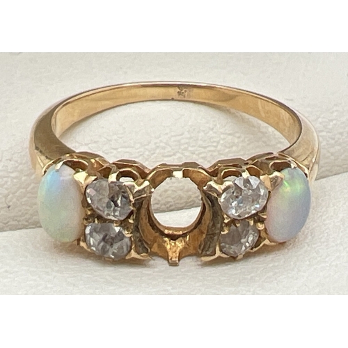 147 - A yellow gold opal and diamond Edwardian style dress ring. Set with 2 oval cut opals and 4 round cut... 