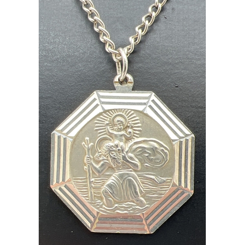 158 - A vintage silver octagonal shaped St. Christopher pendant on a 24