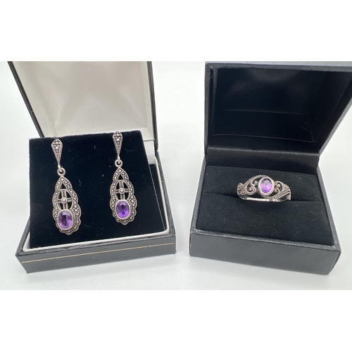 159 - 2 items of silver amethyst set jewellery. A dress ring with bezel set amethyst and scroll detail to ... 