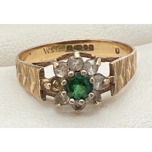 182 - A vintage 9ct gold cluster style ring with central green spinel stone surrounded by 7 round cut clea... 