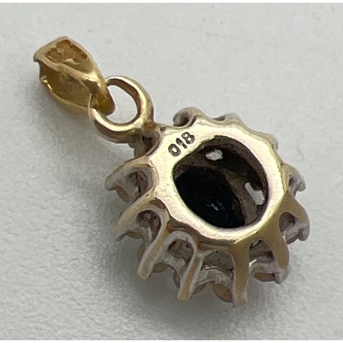 188 - A small 18ct gold pendant set with a central oval cut sapphire surrounded by 12 small round cut diam... 