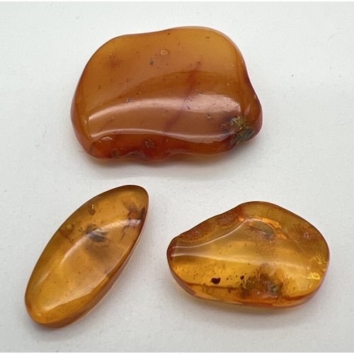 191 - 3 pieces of honey amber for jewellery making, largest piece approx. 2.5cm x 2cm. Total weight approx... 