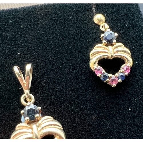 1106 - A 9ct gold vintage drop style heart shaped pendant with matching earrings. Each set with round cut s... 