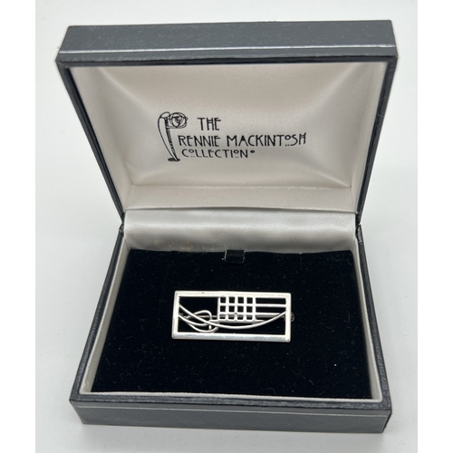 1004 - A boxed silver brooch of tulip and lattice design, from the Rennie Mackintosh Collection .  Silver m... 