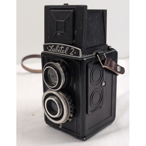 1281 - A vintage 'Lubitel 2' box shaped camera with original brown leatherette case.