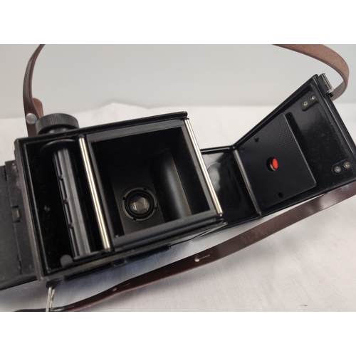 1281 - A vintage 'Lubitel 2' box shaped camera with original brown leatherette case.