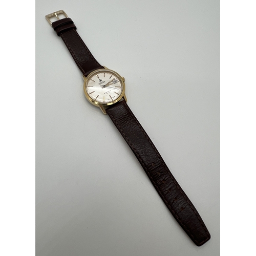 1119 - A vintage Roamer Searock automatic wristwatch with brown leather strap. Gold tone case with white fa... 