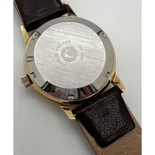 1119 - A vintage Roamer Searock automatic wristwatch with brown leather strap. Gold tone case with white fa... 