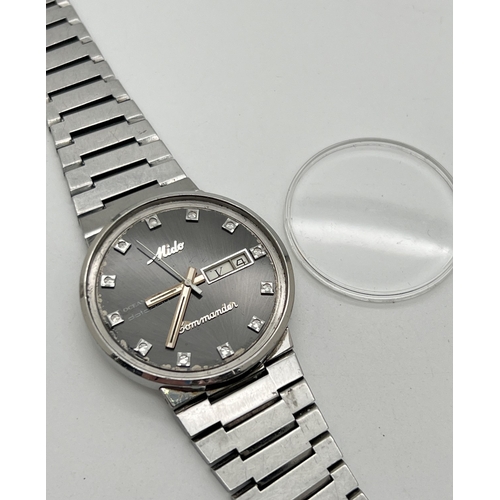 1121 - A vintage 1980's Ocean Star Datoday automatic wristwatch by Mido. Gunmetal grey face with stainless ... 