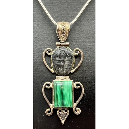 1013 - A modern design silver pendant set with Trilobite fossil and malachite. On a 16
