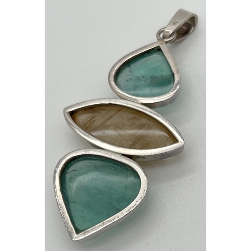 1023 - A large silver modern design pendant set with 2 teardrop cut flourite cabochons and a marquise cut A... 