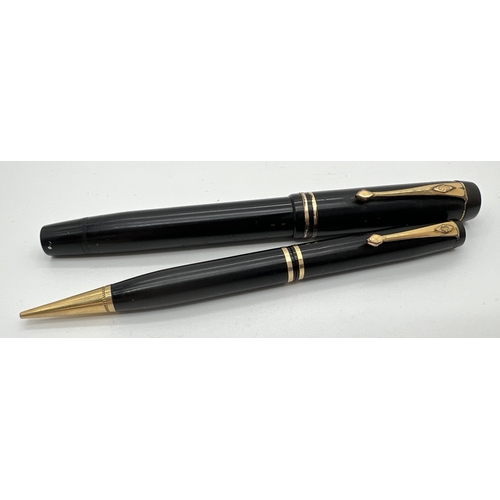 1201 - A vintage Conway Stewart, London No. 30 fountain pen without nib together with a No. 21 propelling p... 