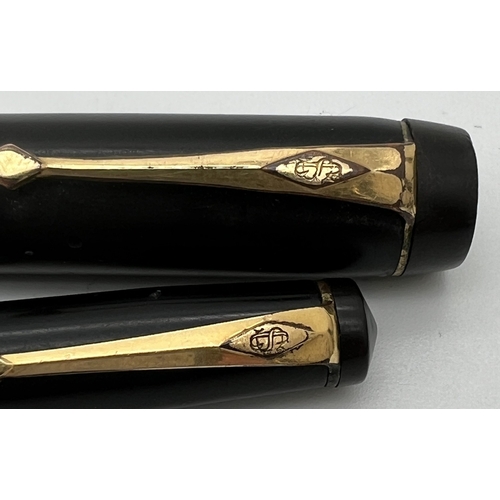 1201 - A vintage Conway Stewart, London No. 30 fountain pen without nib together with a No. 21 propelling p... 