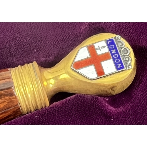 1307 - A cased Wilkinson Sword presentation dagger. Wooden grip with brass plated hardware. Small enameled ... 