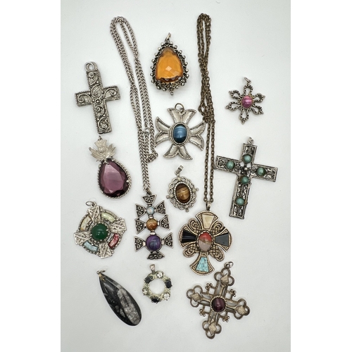 1052 - A collection of vintage Celtic and Scottish costume jewellery pendants, 2 on chains. Many set with n... 