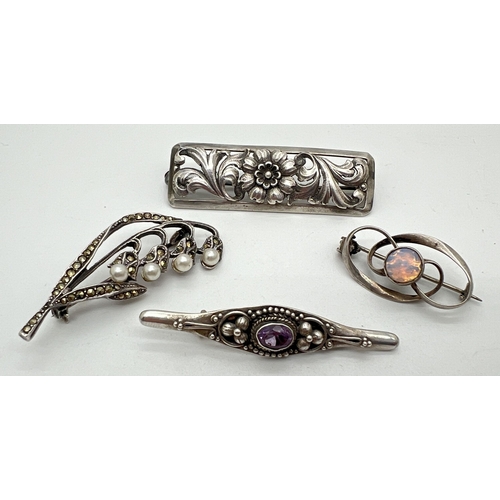 1061 - 4 silver brooches. A Lilly of the valley brooch set with marcasite stones and faux pearls, a floral ... 